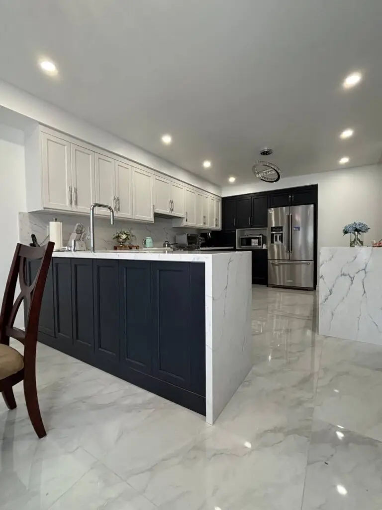 waterfall countertops in modern two-tone kitchen renovation