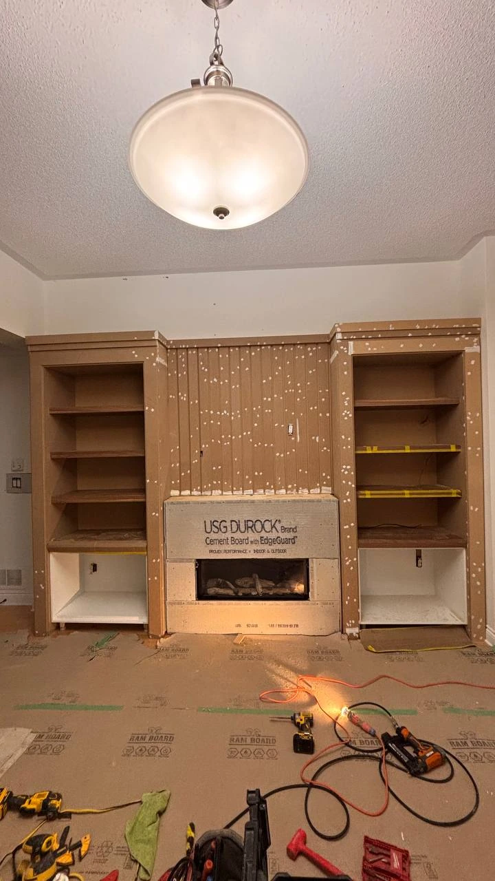 Media wall with shelving, panel details and filled fixing holes before spray painting